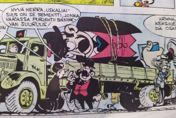 Osa sarjakuvan ruudusta. Auton lavalla on puolikas jättimäisestä Sieninevan pormestarin patsaasta, jonka edessä viiksekäs ja knallipäinen pormestari itse seisoo ja sanoo jollekulle Hyvä herra, uskaliaisuus on se sementti, jonka varassa purjehtii Sieninevan suuruus. Toisessa reunassa pohdiskelee jotakin heihin selin Sieninevan kreivi harmaassa puvussa.